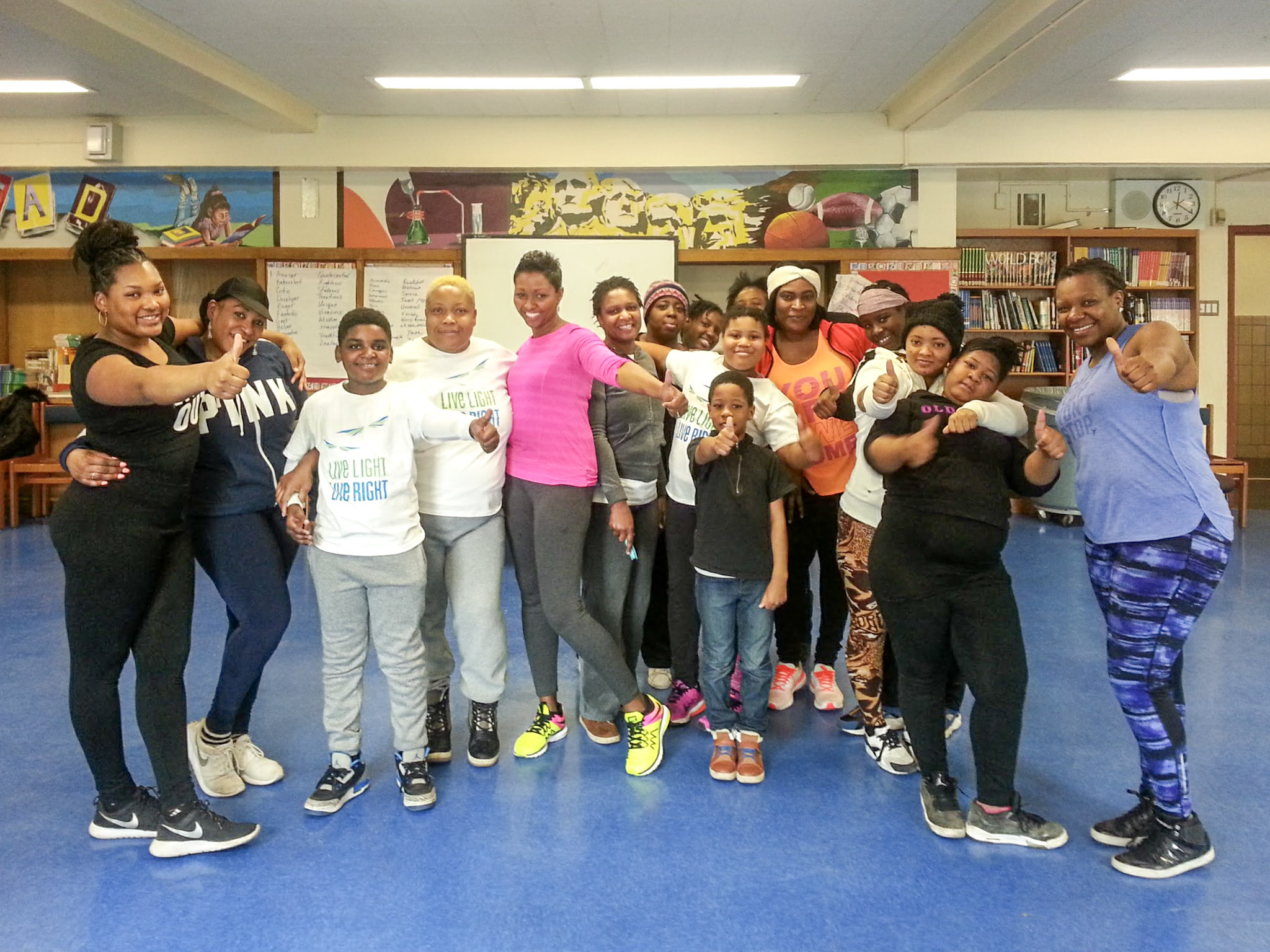 Family dance group photo showing participants of all ages