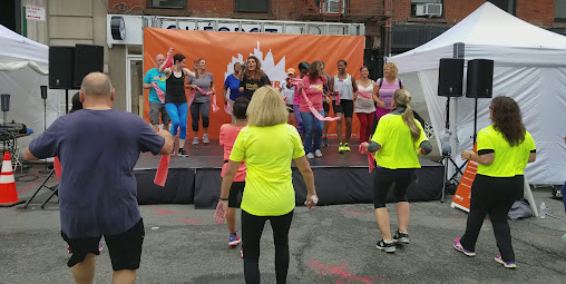 Outdoor community fitness training session with participants