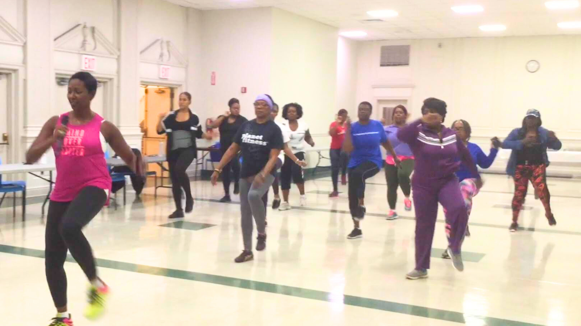 Group fitness class showing people participating in Walking into Wellness program